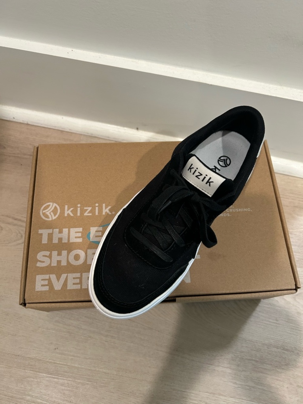 NWOT Kizik Slip on Black and White Sneaker in Original Box
